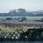 An armoured vehicle patrols the interior at RAF Fairford Airbase [AFP]