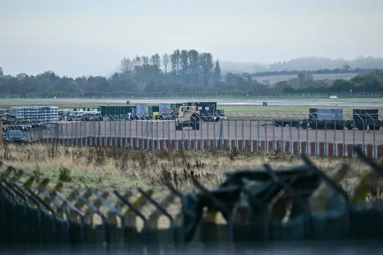 An armoured vehicle patrols the interior at RAF Fairford Airbase [AFP]