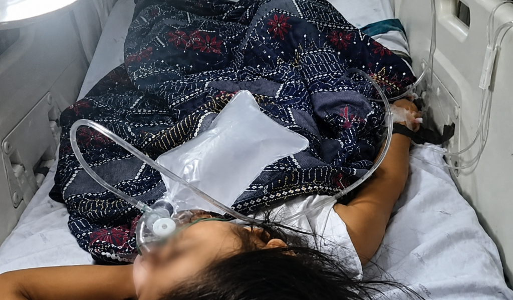Hospital bed with patient and oxygen support- PHOTO FROM 93.5 Brigada Tacloban
