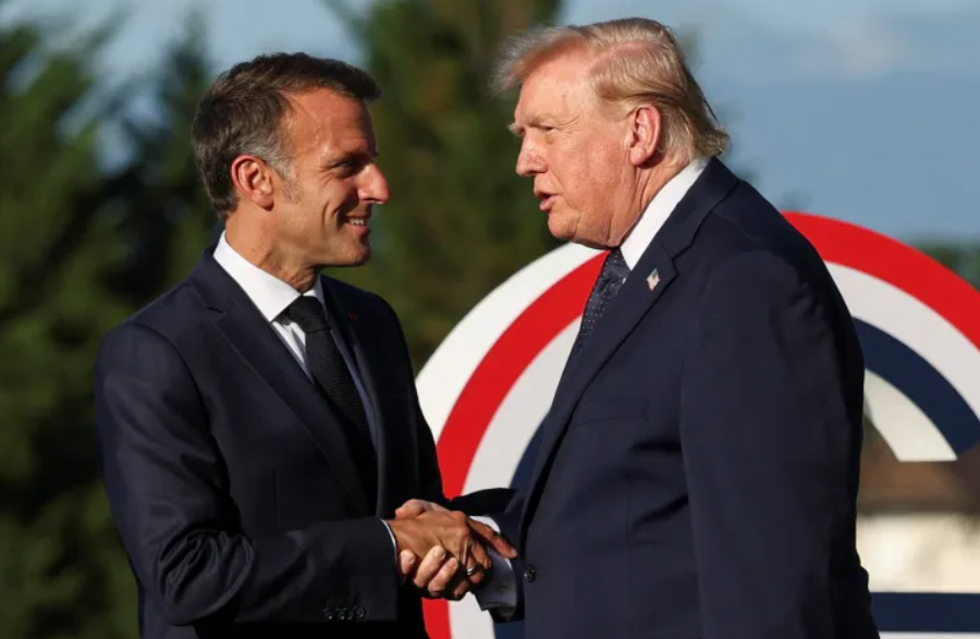 French President Emmanuel Macron greets US President Donald Trump during the G7 summit in Evian-les-Bains, France [Isabel InfantesPoolReuters]