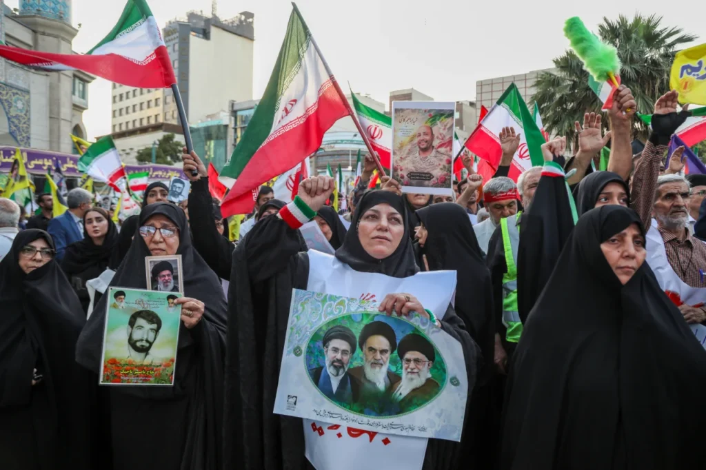 People gather in support and allegiance to Iranian Supreme Leader Mojtaba Khamenei at Palestine Square in Tehran, Friday. Majid Saeedi/Getty Images