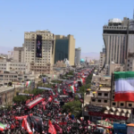 Visible in the foreground is a large Iranian national flag prominently displayed / Photo Aljazeera