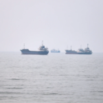 Commercial vessels are seen in the Strait of Hormuz off Bandar Abbas, Iran, Tuesday, June 30, 2026. (Amirhosein Khorgooi/ISNA via AP)