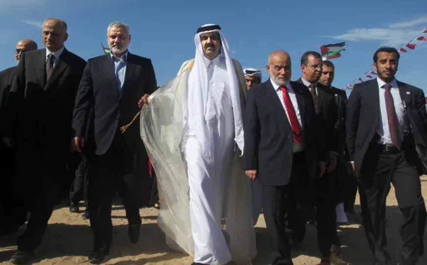 Palestinian leaders and the former Emir arrive at a cornerstone-laying ceremony for a new residential neighbourhood called Hamad in Khan Younis, / Phot File Getty Imagges