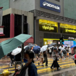 Passersby walk in Hong Kong's Mong Kok AP Photoo