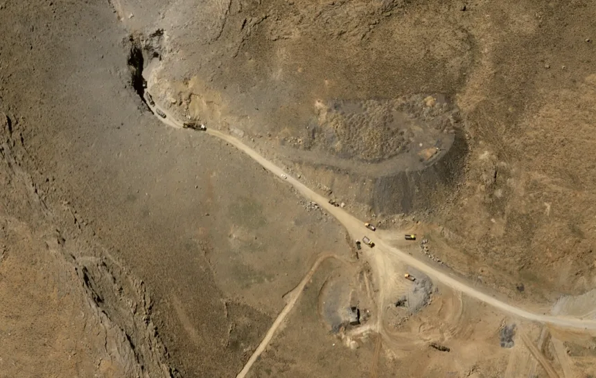 A satellite image of an underground missile base near Khomeyn, Iran, shows at least 10 construction vehicles working to clear a tunnel entrance on April 15, 2026. Airbus
